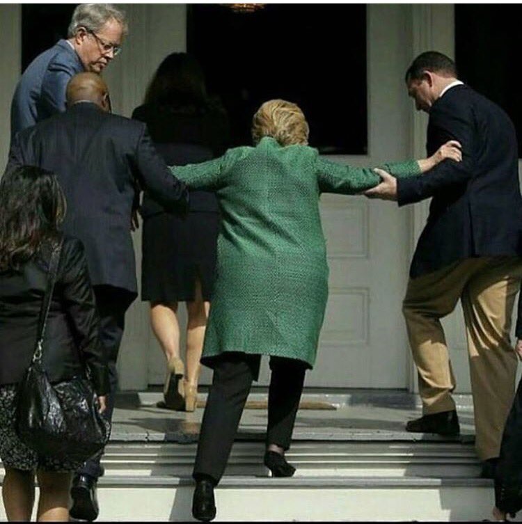 Hillary Clinton Helped Up Steps